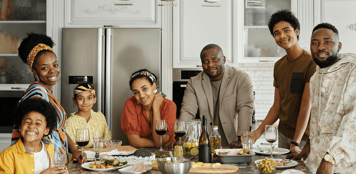 Family enjoying a meal together in a modern kitchen